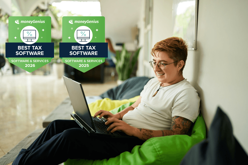 Person using a laptop while sitting on a couch, with two MoneyGenius award badges displayed for Best Tax Software in 2025 and 2026.